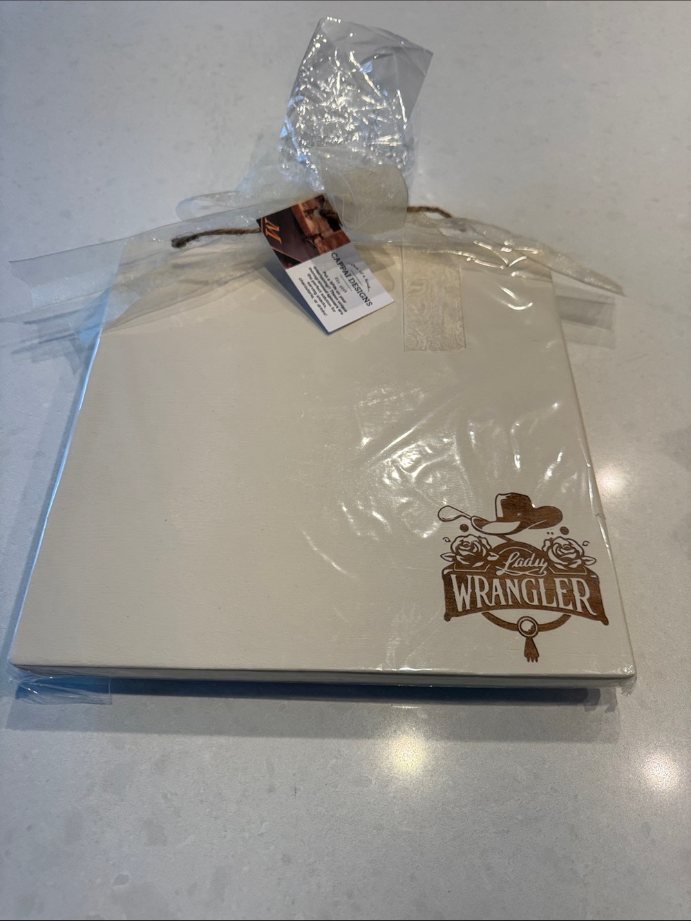 Wrangler Lady wood serving piece in Cream with Brown Logo cappai design